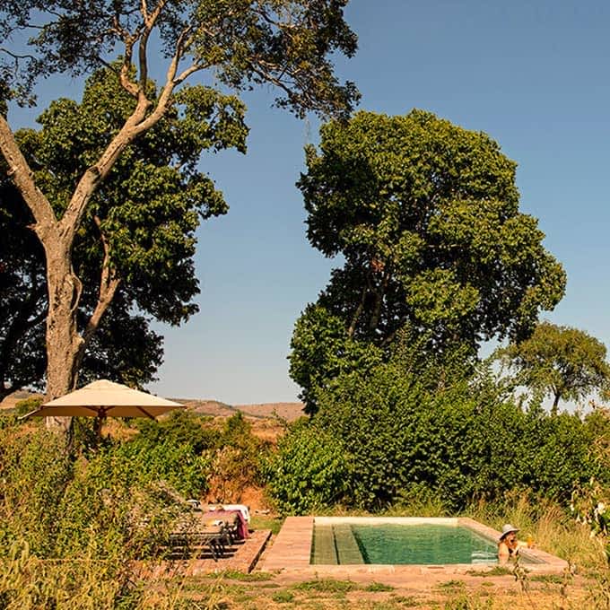 Enjoy a Masai Mara luxury safari and cool off in the swimming pool at Elewana Sand River Camp
