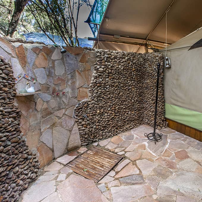 All rooms at Karen Blixen Camp have an outdoor shower