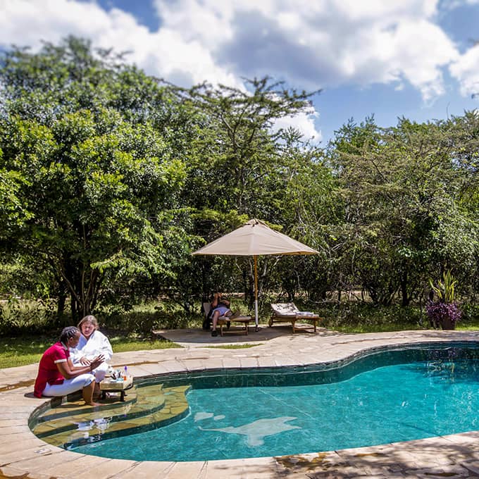 Cool off in the swimming pool at Karen Blixen Camp in Mara North